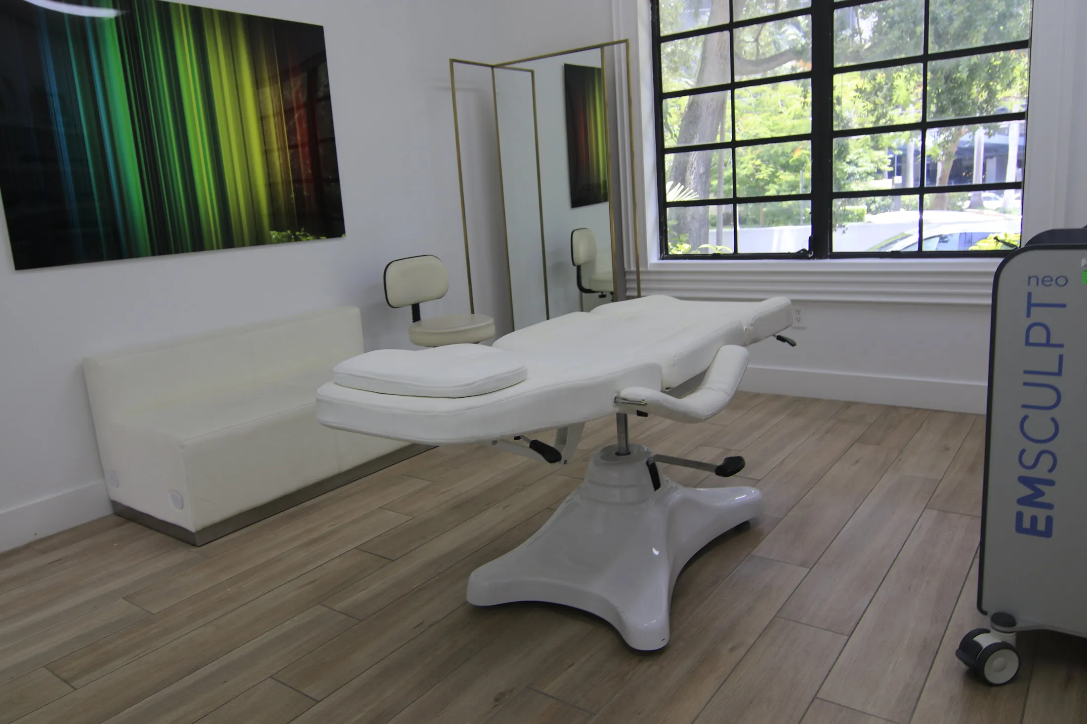 Body-contouring room with the Emsculpt Neo console at Miami Skin Spa in Brickell, Miami
