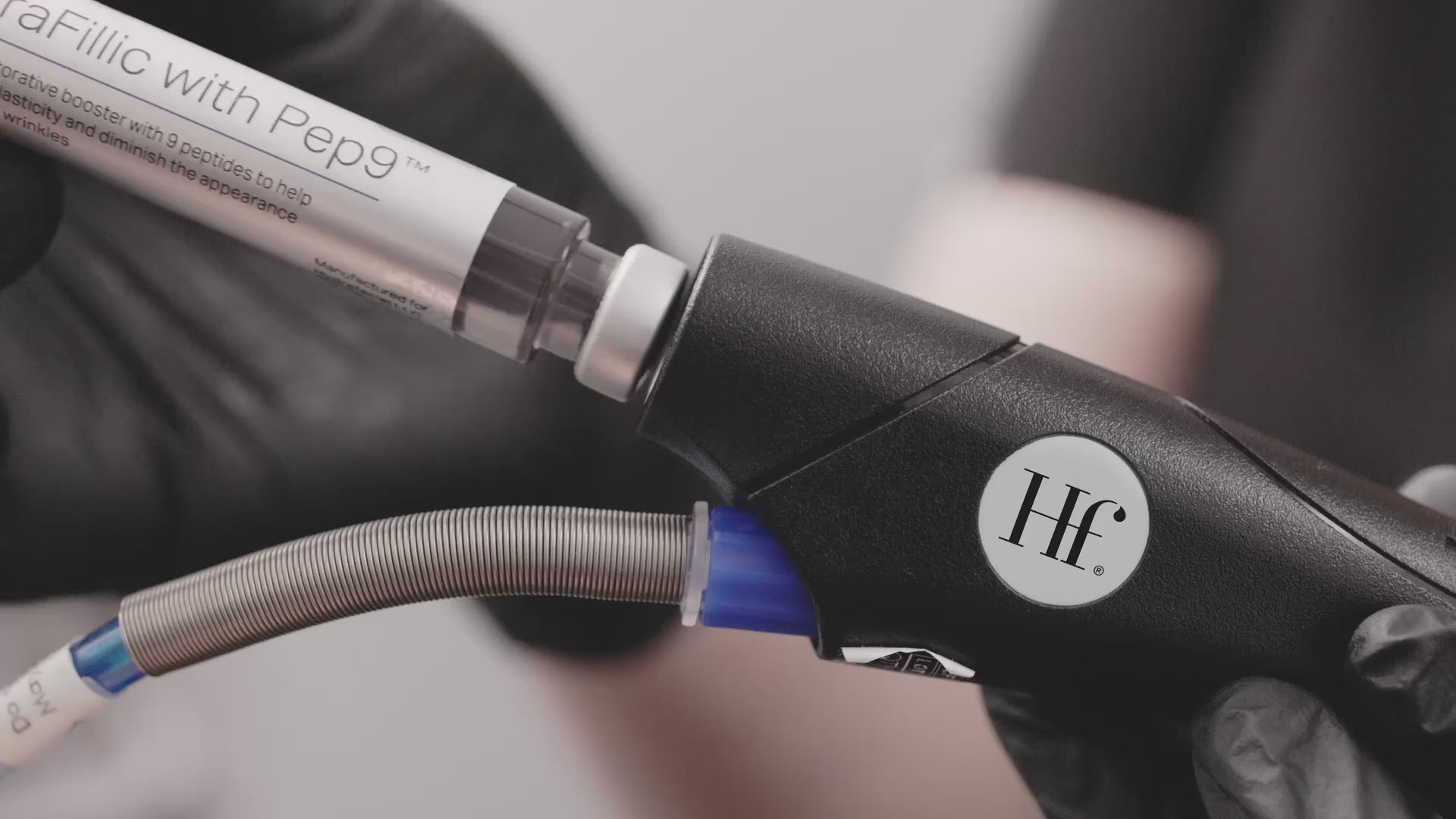 HydraFacial device with Pep9 booster, gloved hands, in-clinic treatment