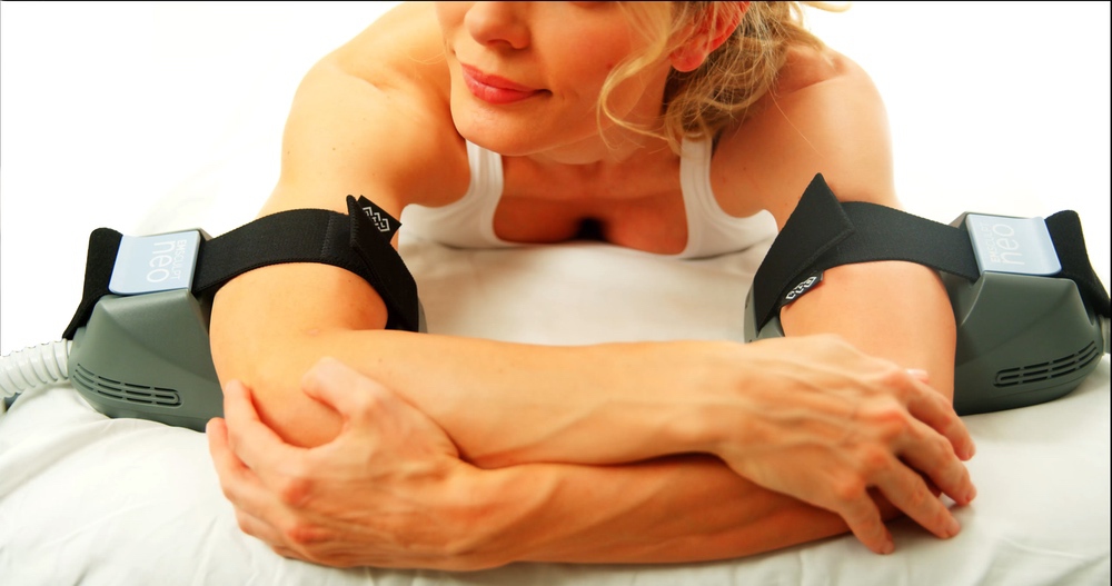 Muscle sculpting at Miami Skin Spa in Brickell — HIFEM applicator on arms